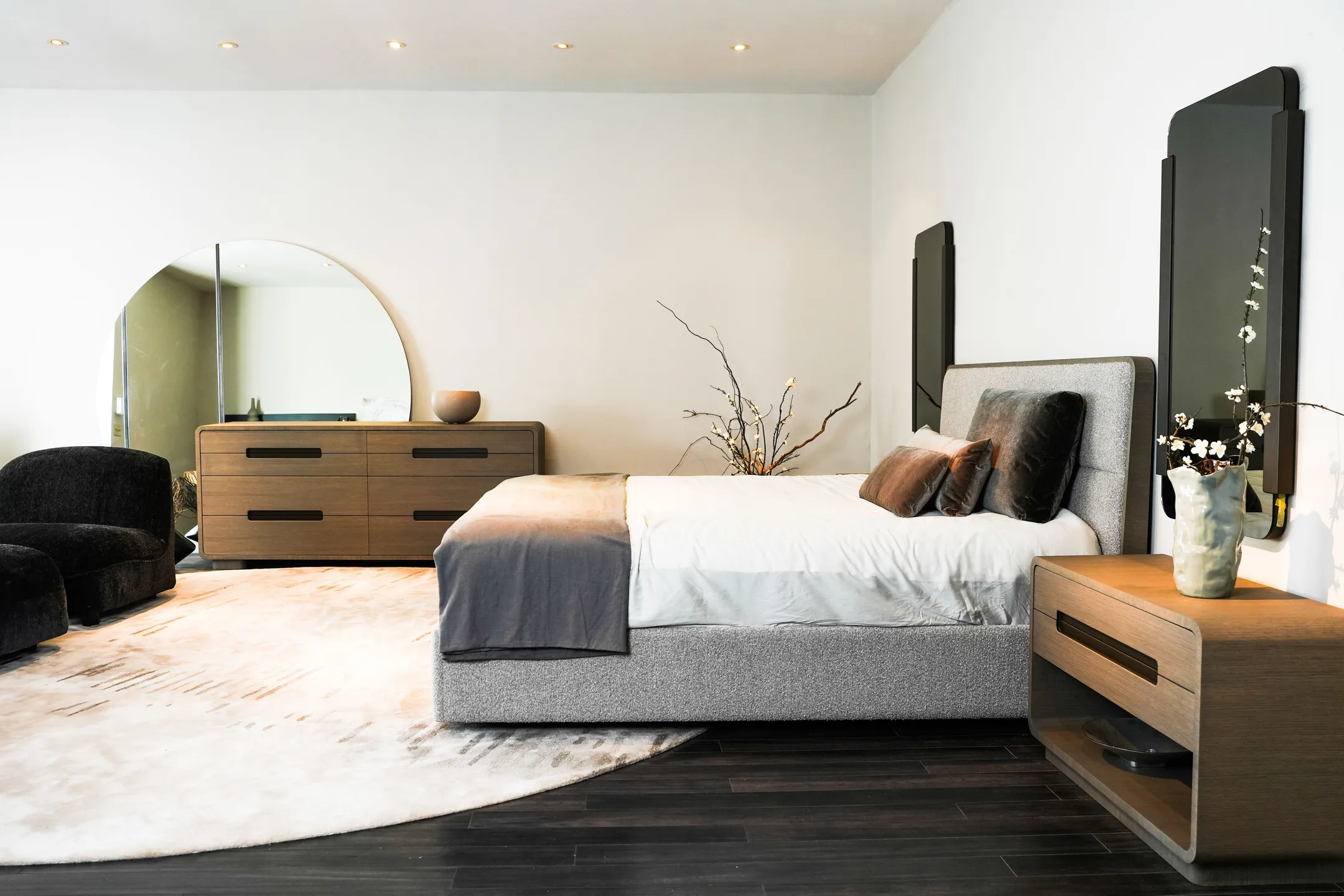 A photo of an elegantly-designed bed in a modern and artistic bedroom setting