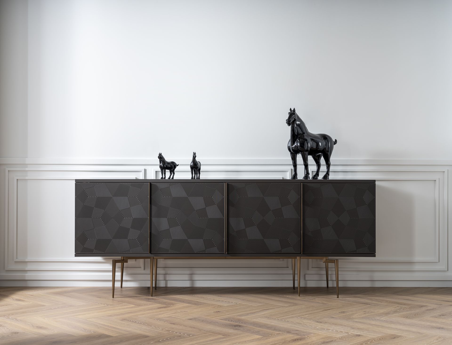 A picture of a Mobi sideboard with horse sculptures on it