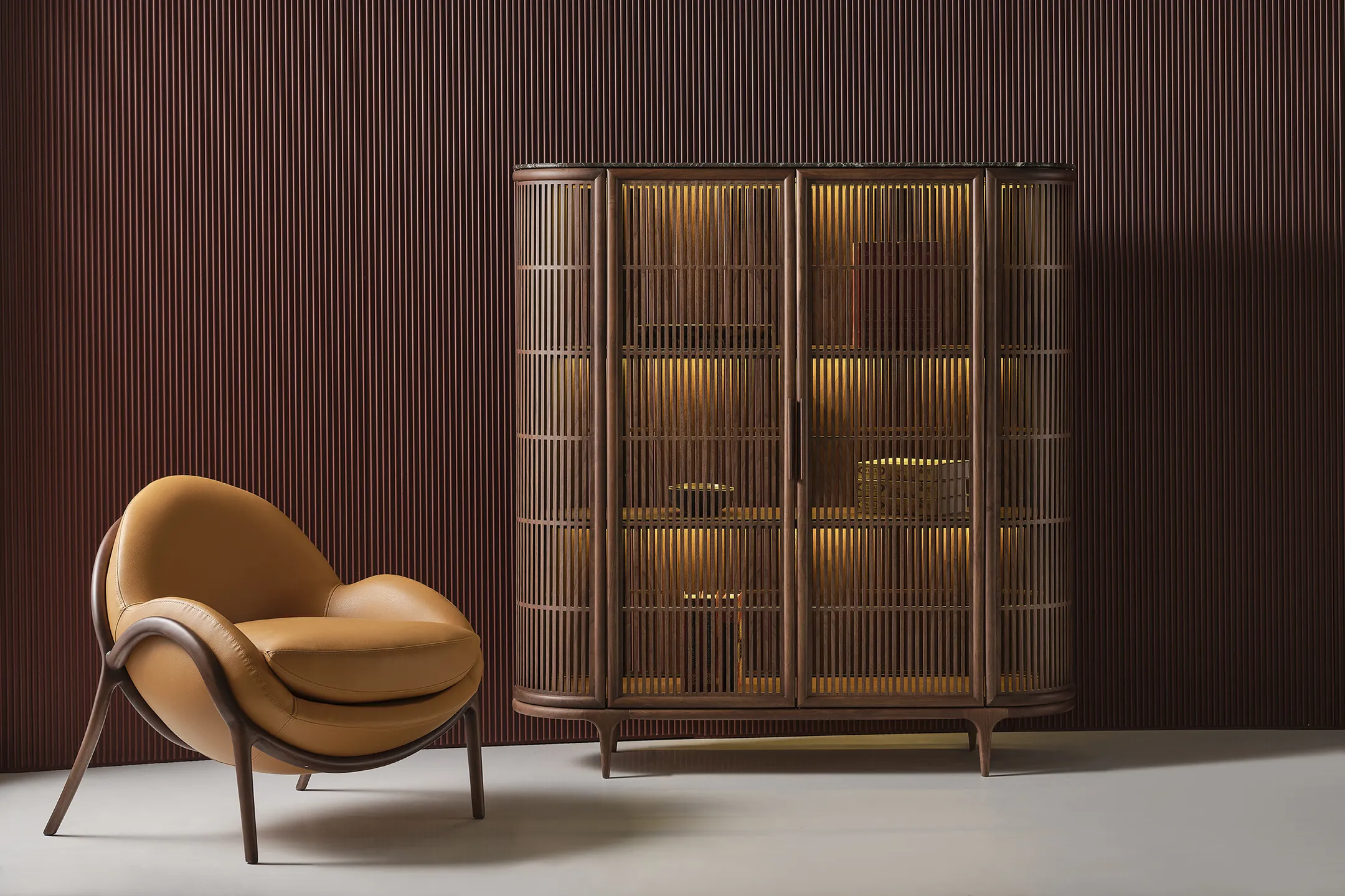 A wooden storage cabinet with a slatted wood front, illuminated from within by gentle golden lights